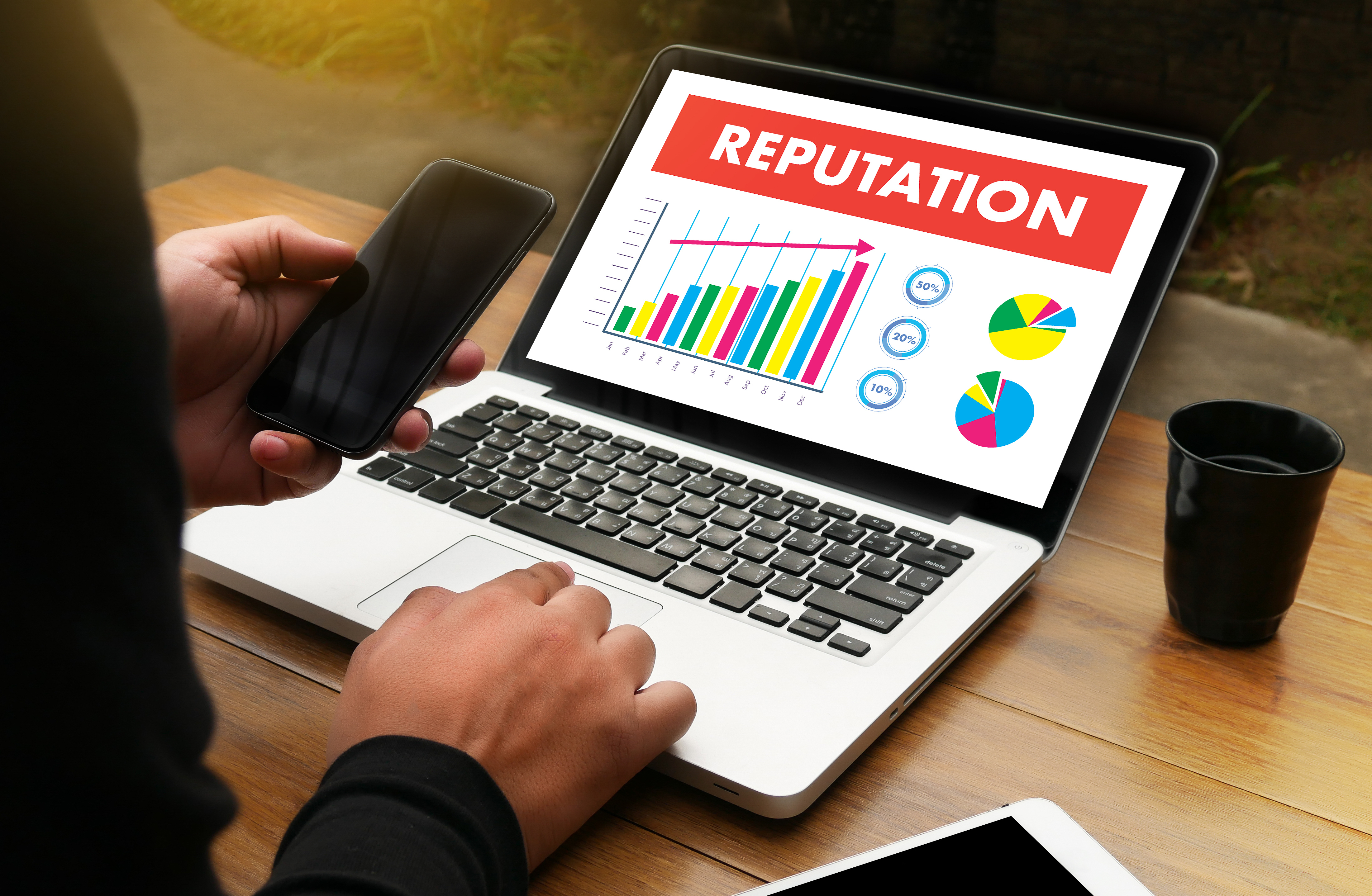 A laptop showing online reputation management statistics